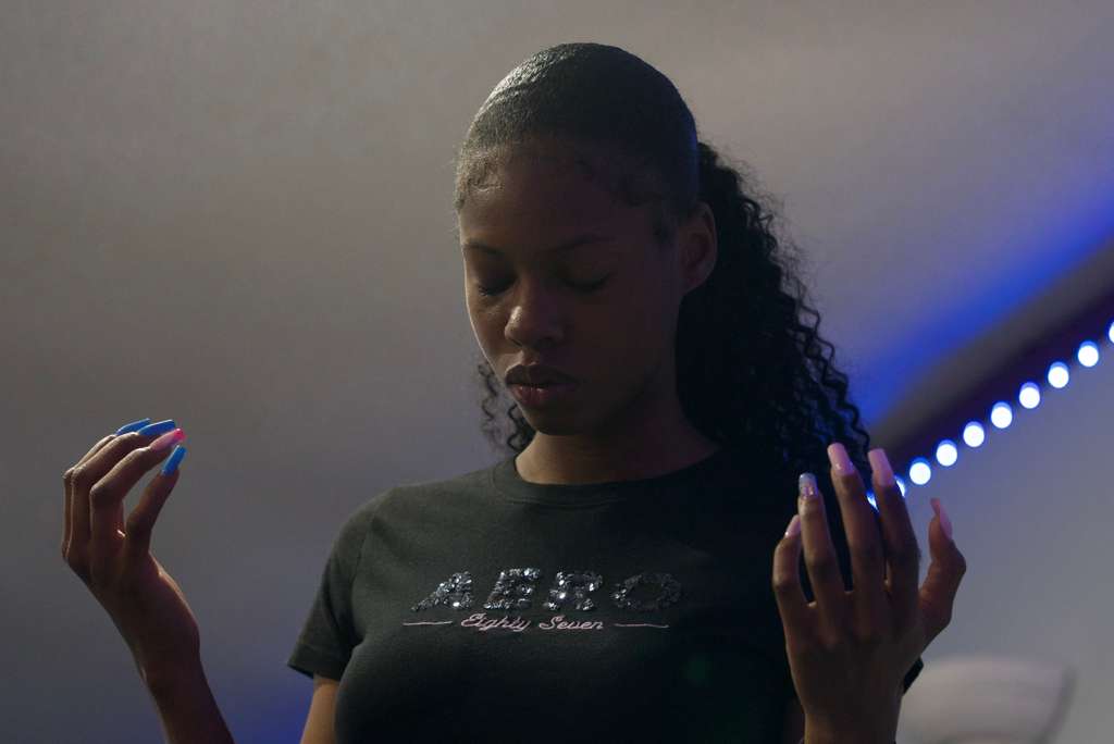 Young woman lifting hands in worship