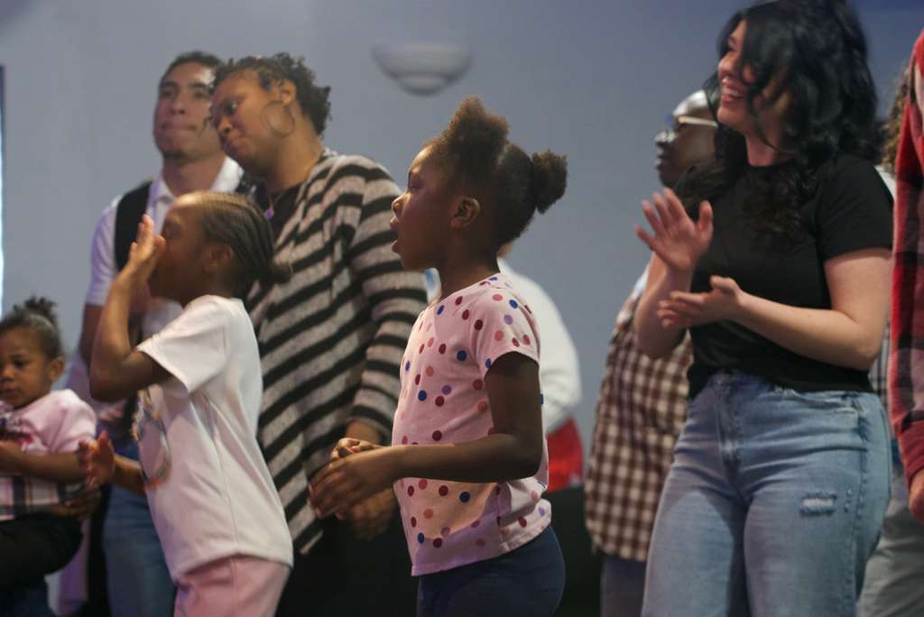 Children worshipping with the congregation